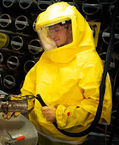 BWXT field services employee safety glasses hazmat suit