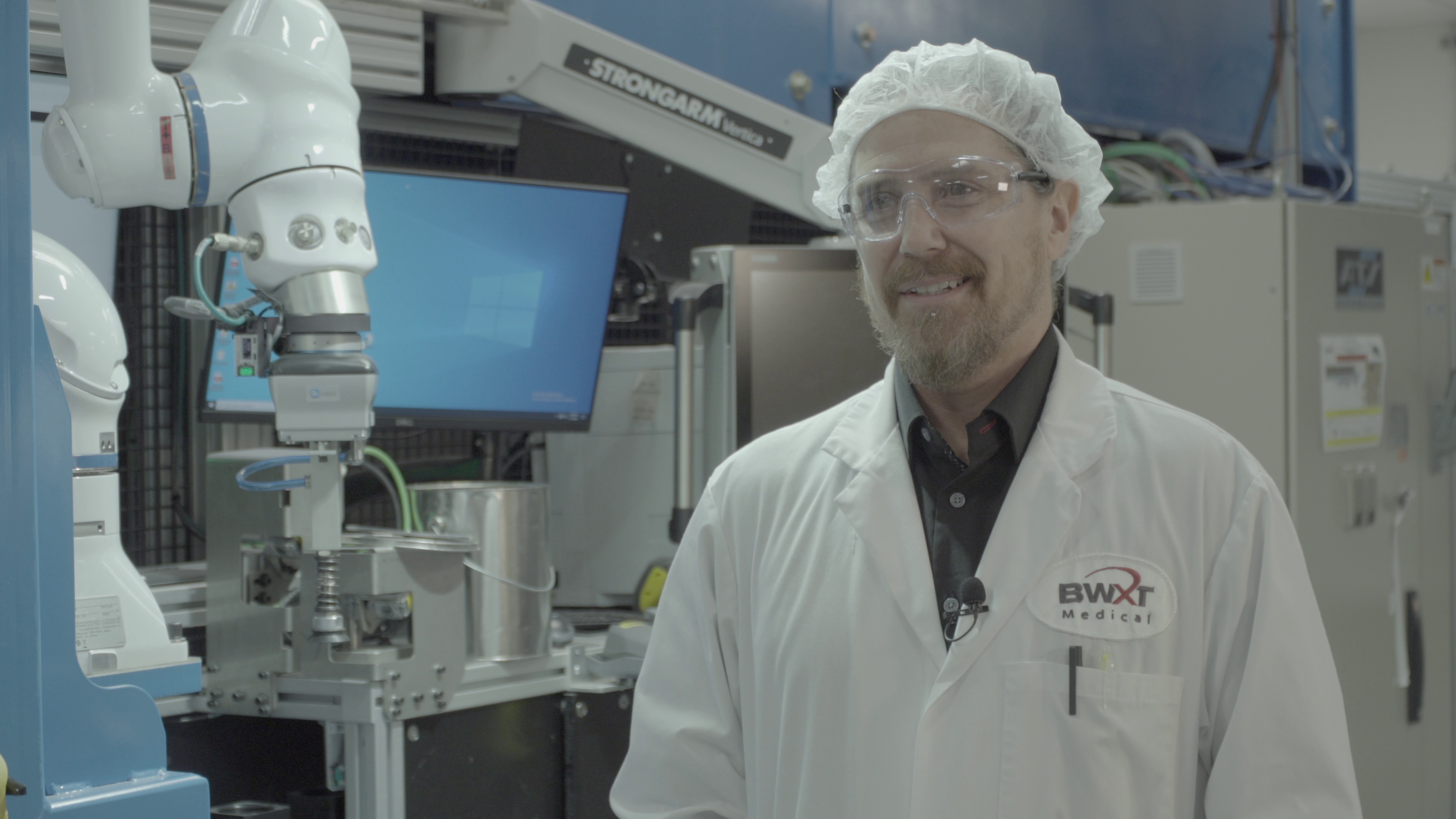 BWXT Employee faces camera from BWXT Medical.